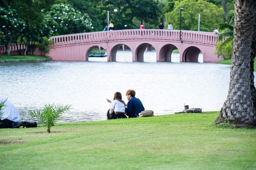 People sitting in the park. The park is a place to relax, talk, for everyone.