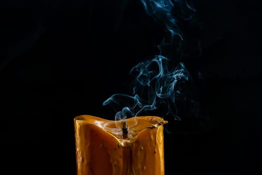 The big candle smoke is colorful. It is abstract.