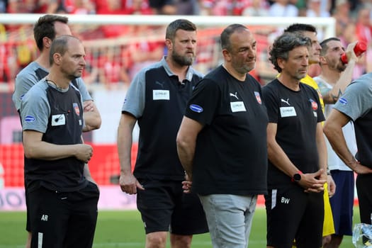 Coach Frank Schmidt (1. FC Heidenheim) and his staff follow the farewell of coach Christian Streich (SC Freiburg) on the pitch after the game of the 1. FBL: 23-24: 33.  DFL REGULATIONS PROHIBIT ANY USE OF PHOTOGRAPHS AS IMAGE SEQUENCES AND/OR QUASI-VIDEONann  Photo: Joachim Hahne/johapress