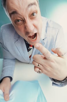 Middle-aged broadcaster shows a look of sheer surprise while examining a paper, his reaction intense and immediate