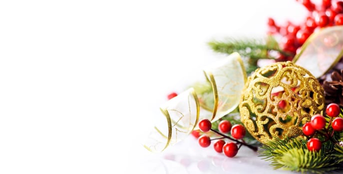 Golden chrismtas ornament ball with fir tree and gold ribbon isolated on white background. Happy new year greeting card design. Luxury celebration decor banner layout.