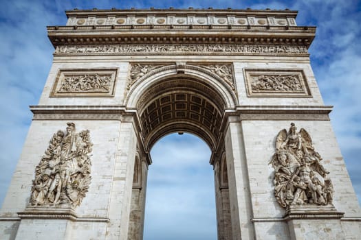 Arch of Triumph on a sunny day in Paris, France.