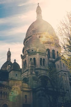 Sacre Coeur in Paris, France, with a strong lens flare.
