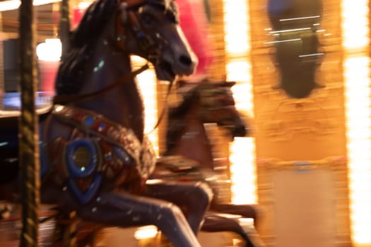 Florence, Italy - 30 April 2024. Carousel horses. Antique merry-go-round, vintage nostalgia concept