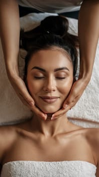 a young woman getting a head massage at a beauty spa.