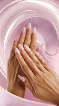 Close-up of hands with elegant floral nail art in swirling pink tones, exuding soft and graceful style.