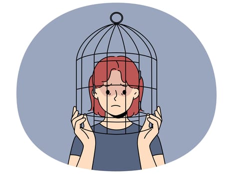 Unhappy teenager girl with head in birdcage suffer from discrimination and lack of freedom. Upset teen child locked in cage struggle with psychological problems. Vector illustration.