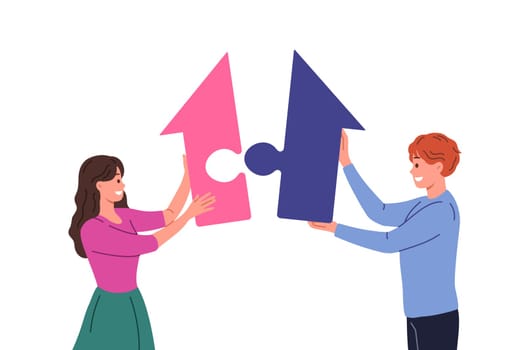 Buying family property by couple of man and woman putting together large puzzle in shape of house. Happy young people strive to rent apartment or buy house to improve living conditions