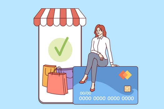 Phone for mobile shopping and woman shopper sitting on credit card to pay for online purchases. Smartphone with digital supermarket for internet shopping and ordering goods with targeted delivery