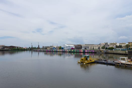 La Boca neighborhood view with few people, Buenos Aires. Painted riverwalk