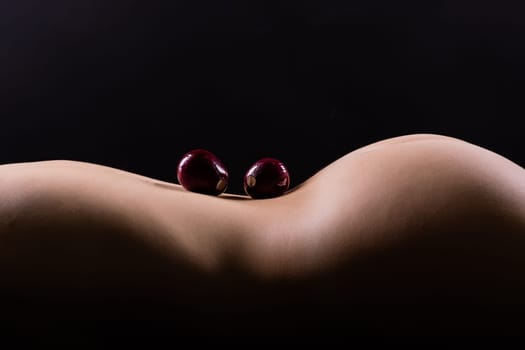 Close up of a woman back with laying onion, low key