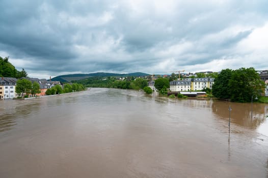 Flood of the river Saar, Saarburg in Saarland, Germany, flooded trees and paths, high water level, climate change