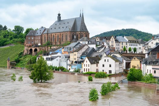 Flood of the river Saar, Saarburg in Saarland, Germany, flooded trees and paths, high water level, climate change