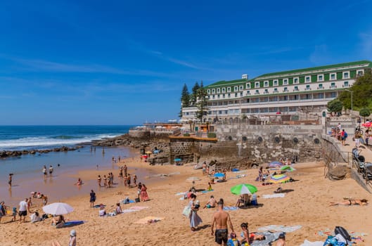 Sintra, Portugal: April 13, 2024: People at Praia do sul beach, Ericeira, Sintra, Lisbon coast, Portugal