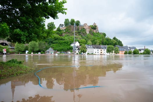 Flood of the river Saar, Saarburg in Saarland, Germany, flooded trees and paths, high water level, climate change