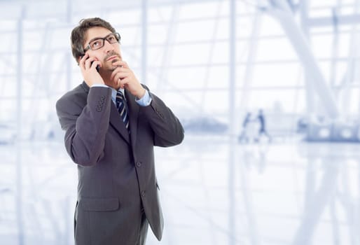 happy business man on the phone, at the office