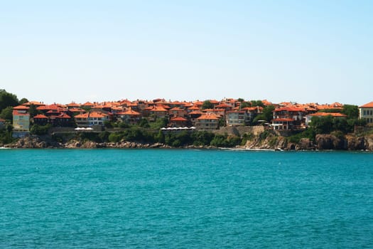 View onto the old town of Sozopol, Sosopol with the intense turquoise blue water of the black sea in the foreground, Bulgaria 2022