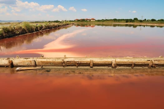 One of the pools at the Burgas Salt Pans, water of intense pink color, Lake Atanasovsko, Atanasovo, Burgas, Bourgas, Bulgaria 2022