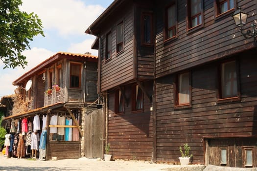 Traditional wooden houses in the old town of Nessebar, Nesebar, one houses a clothing store in the ground floor, Bulgaria 2022