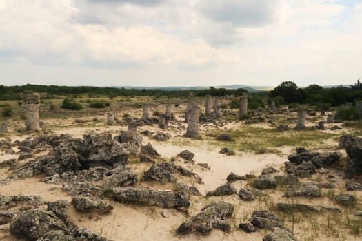 View over the stone forest of Pobiti Kamani, many stone pillars are rising from a desert-like landscape near Varna, Bulgaria 2022