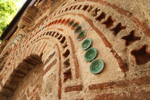 Rows of tiles and bricks decorate the elaborate facade of the Church of St., Saint Paraskevi, Sveta Paraskeva in the old town of Nessebar, Nesebar, Bulgaria 2022