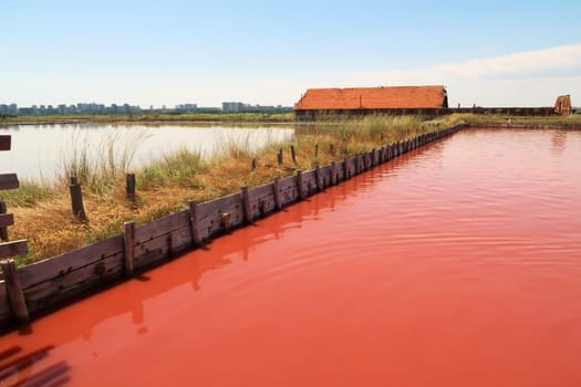 The main bathing, swimming pool at the Burgas Salt Pans, water of intense pink color, Lake Atanasovsko, Atanasovo, Burgas, Bourgas, Bulgaria 2022