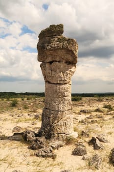 Stone pillar in the shape of a head, face at the Pobiti Kamani Stone Forest near Varna, Bulgaria 2022