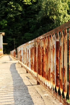 Rusted, rusty railing, handrail, rail at an abandoned dam on the Yantra River in Veliko Tarnovo, Bulgaria 2022