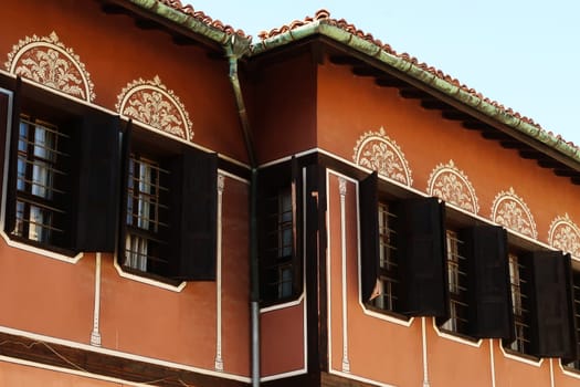 Decorated windows on the facade of the Balabanov House, an example of National Revival Architecture in the old town of Plovdiv, Plowdiw, Bulgaria 2022