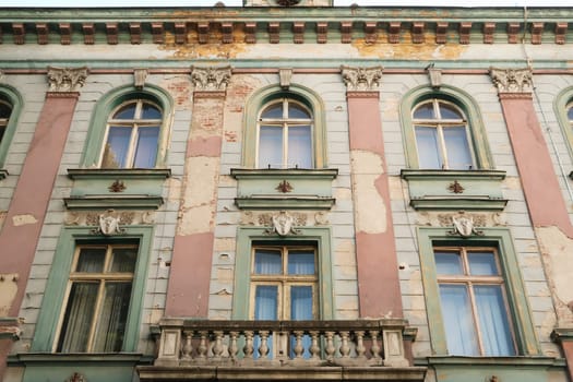 A balcony and windows on the beautiful upper facade of the former Bulgarian National Bank building in the old town of Plovdiv, Plowdiw, Bulgaria 2022