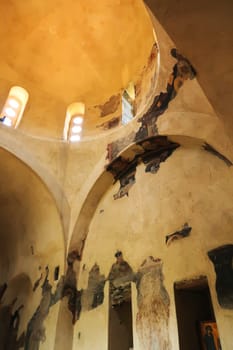 Inside the Church of the Holy Mother of God in the medieval Asen's, Asens Fortress, only parts of the former christian frescos, wall paintings are left, near Plovdiv, Bulgaria 2022