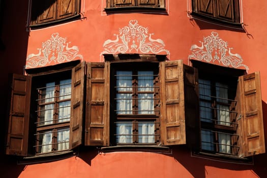 Three windows on the facade of the Georgiadi House, an example of National Revival Architecture in the old town of Plovdiv, Plowdiw, Bulgaria 2022