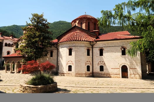 View over the courtyard to the Assumption of the Holy Virgin Church, the main church of the Bachkovo Monastery, close to Plovdiv, Bulgaria 2022