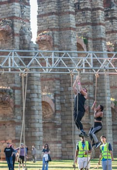 Merida, Spain - May 18th, 2024: FarinatoRace Merida 2024, Participants climbing a rope