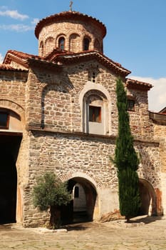 The facade of the Church St., Saint Archangels Michael and Gabriel in one of the courtyards of the Bachkovo Monastery, close to Plovdiv, Bulgaria 2022