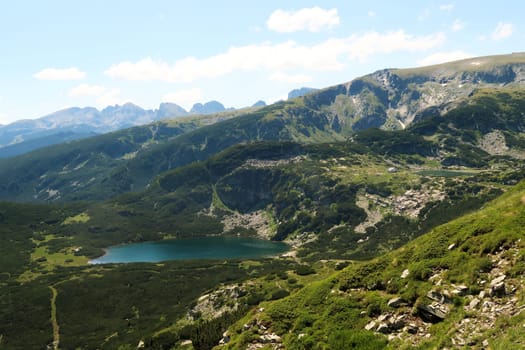 View onto the Lower Lake, Dolnoto Ezero and the Fish Lake, Ribnoto Ezero with the Seven Lakes Chalet right next to it at the Seven Rila Lakes Plateau, Rila National Park close to Sofia, Bulgaria 2022