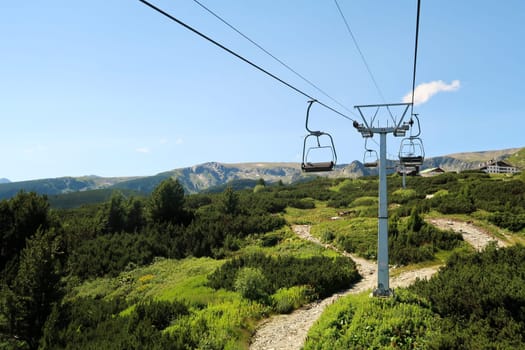 On the chairlift, lift up to the plateau of the Seven Rila Lakes in the Rila National Park, the lift station and the Rila Lakes Chalet can be seen at the top, close to Sofia, Bulgaria 2022