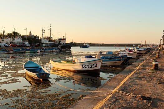 Many small fisherboats tied up in the harbor, port next to the old town of Sozopol, Sosopol, Bulgaria, 4th of July 2022
