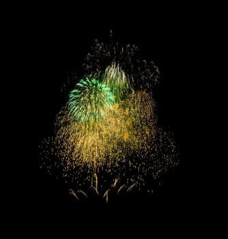 Colorful fireworks exploding in the night sky, isolated on black background. New year and anniversary concept.