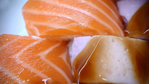 Japanese food sushi rolls of red fish and ham with sweet sauce. Texture or background.View from above.Macrophotography.
