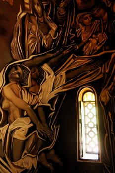 Mural, wall painting, fresco next to a little window inside the Patriarchal Cathedral, Church of the Holy Ascension of the Lord inside the Tsarevets Fortress in Veliko Tarnovo, Bulgaria, 11th of July 2022