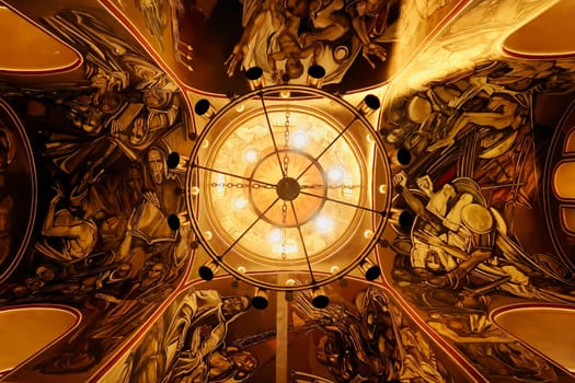 The ceiling inside the Patriarchal Cathedral, Church of the Holy Ascension of the Lord, completely covered in modernist murals, wall paintings, frescos showing scenes from the history of Bulgaria, Tsarevets Fortress, Veliko Tarnovo, Bulgaria, 11th of July 2022
