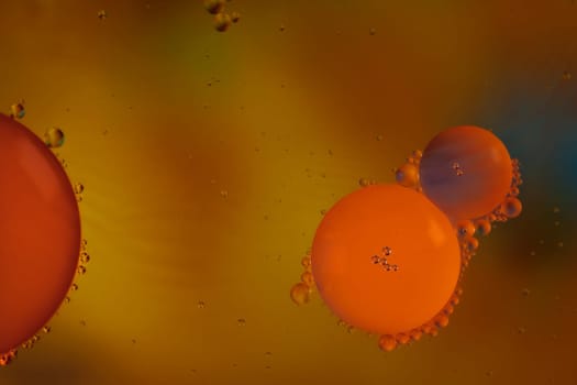 Colorful abstract macro background with oil drops in water