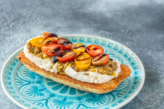 Bruschetta with burrata cheese, pesto and tomatoes