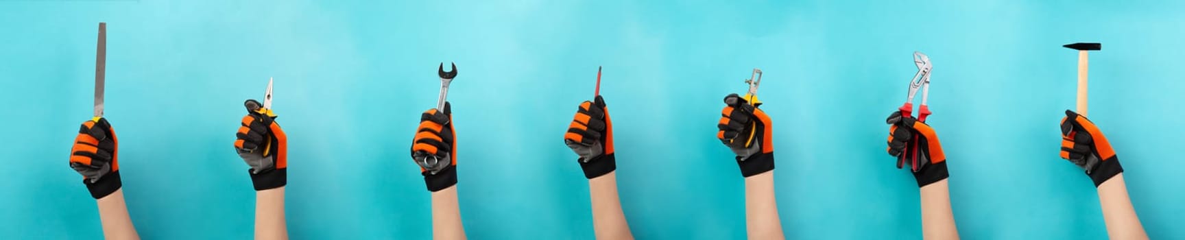 Craftsman or handyman with different tools in the hand, labor day, craft and apprentice, hammer, pliers and wrech