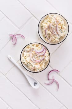 Fish and egg spread, paste or salad with red onions