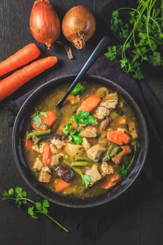 Homemade meat and vegetable stew or soup with mushrooms