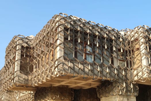 The cubic shapes that form the facade of the National University Library of Kosovo, covered by a metal grid, net, an example of socialist, brutalist architecture in the city center of Prishtina, Pristina, Kosovo 2022