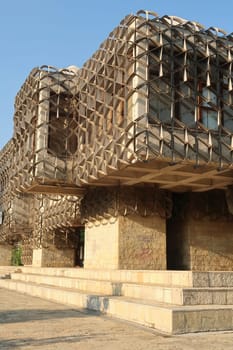 The facade of the National University Library of Kosovo, consisting of cubic shapes and covered by a metal grid, net, an example of socialist, brutalist architecture in the city center of Prishtina, Pristina, Kosovo, 2022