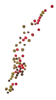 Red, green and black peppercorns scattered on isolated background, close up